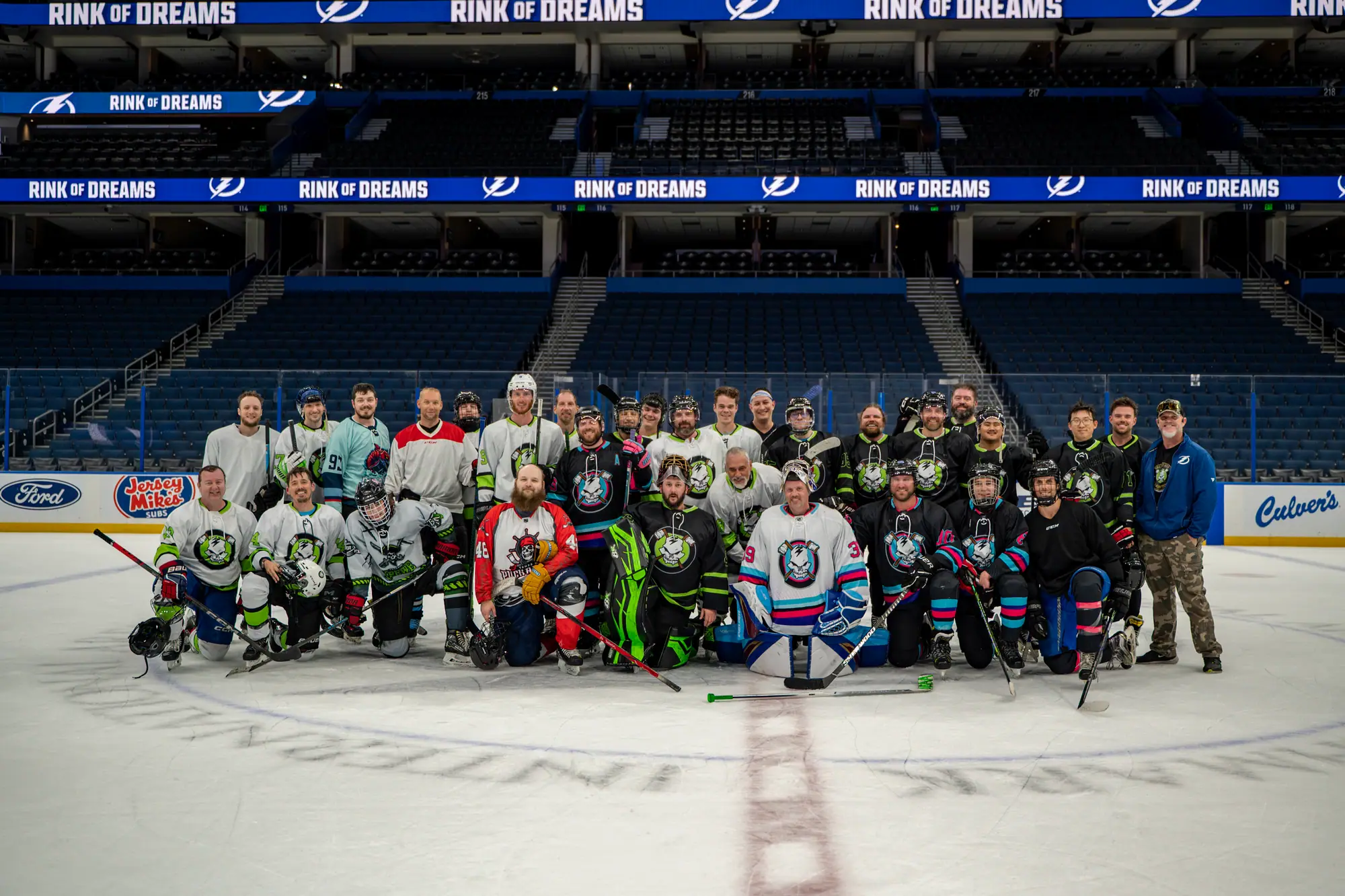 Stick N Bones players and families gathered at center ice for the Rink Of Dreams